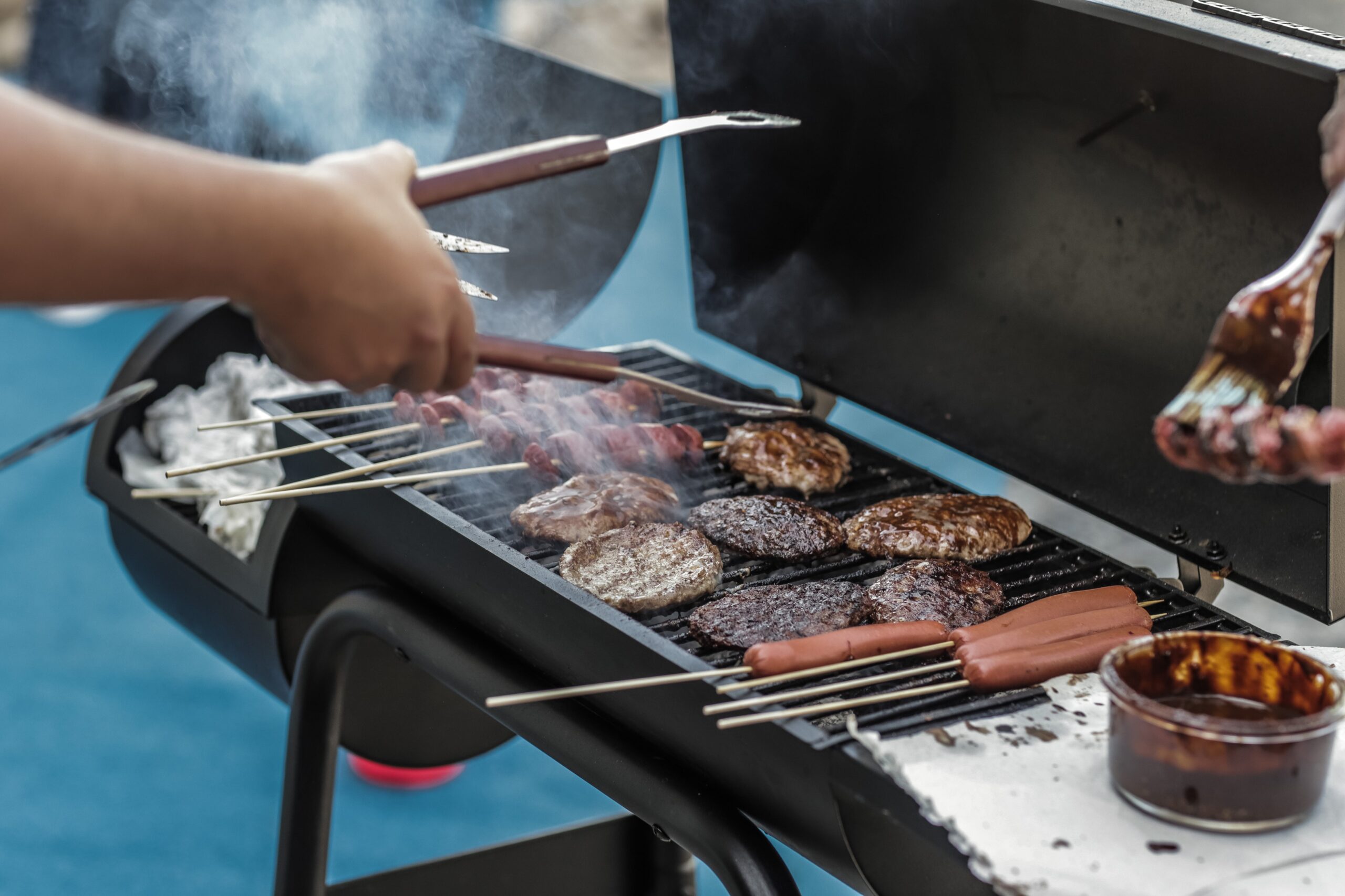 Person grilling at an employee appreciation occasion
